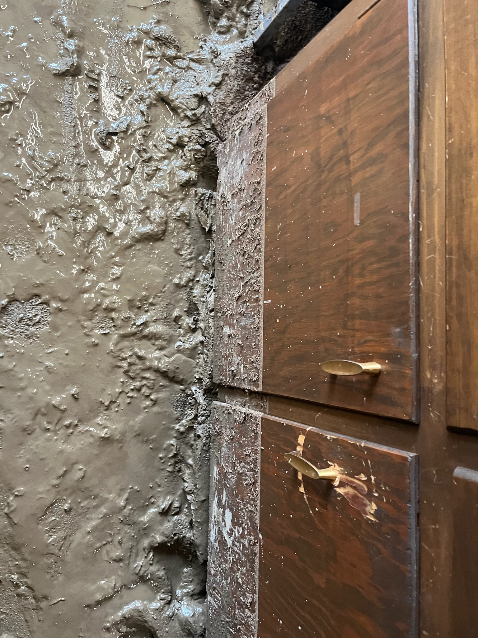 A wooden cabinet positioned centrally against a wall