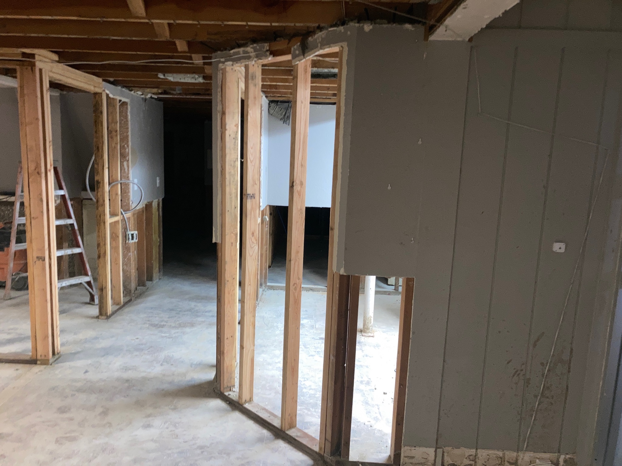 A room featuring unfinished walls