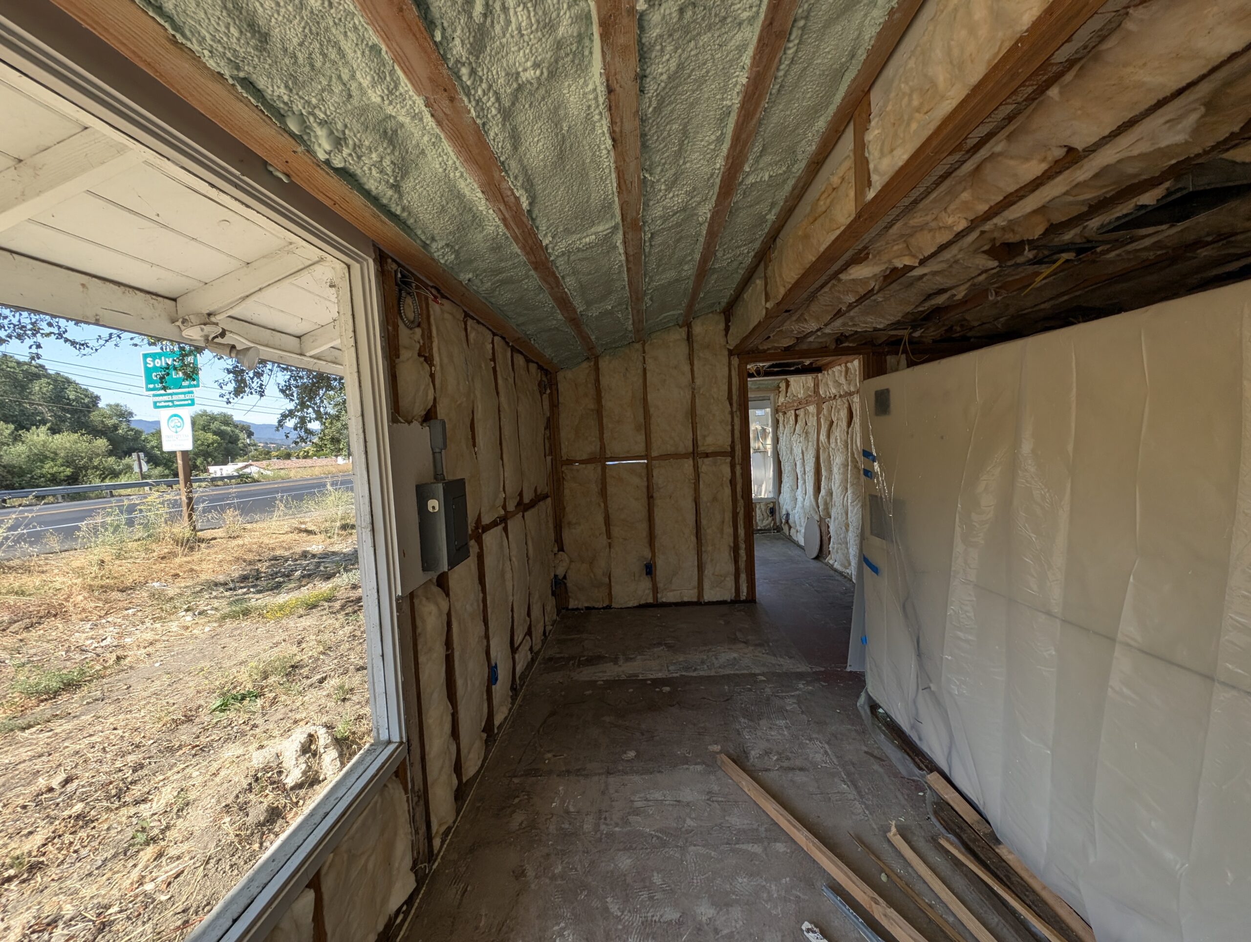 A room featuring a window with insulated walls